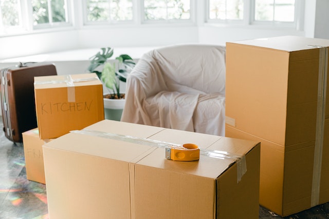 Living room full of brown moving boxes